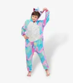 Young boy playfully holding the ear of his starry galaxy sleepwear suit.