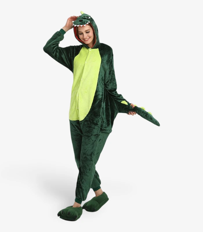dinosaur-onesie-for-adults Woman smiling playfully and holding the tail while wearing the comfortable Dinosaur Onesie For Adults.