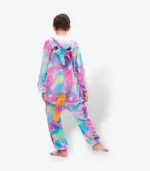 Back angle of colorful children's pajamas showing the rainbow tail and star pattern across the fabric.